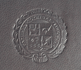country club seal debossed on black leather