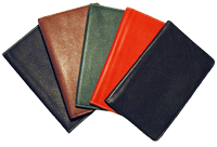 black, tan, red and green leather pocket journals